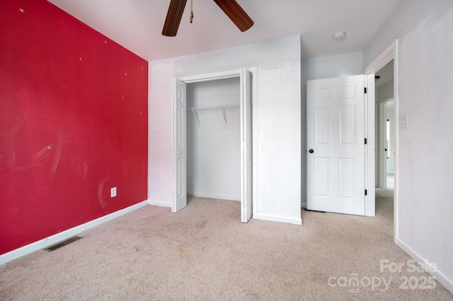 92 Le-An-Hurst Rd, Asheville, NC 28803 - unfurnished bedroom featuring carpet, baseboards, a closet, and a ceiling fan