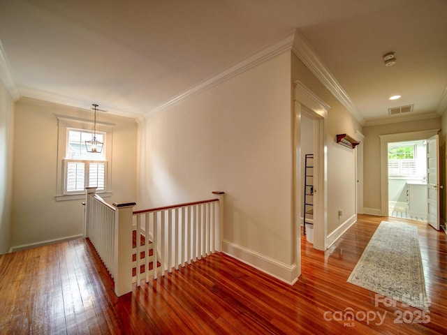 226 Union St S, Concord, NC 28025 - hall featuring an upstairs landing, wood-type flooring, crown molding, and baseboards