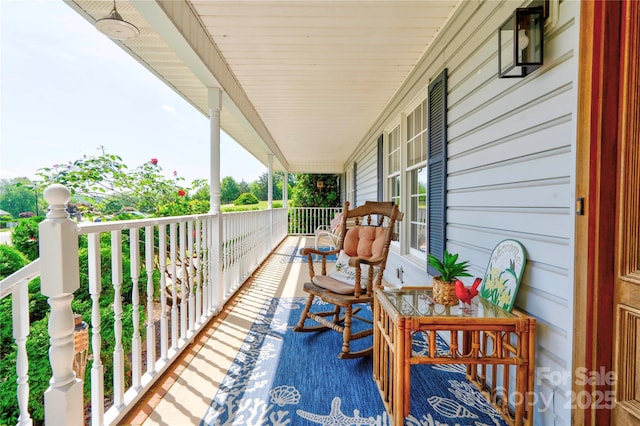 balcony featuring a porch