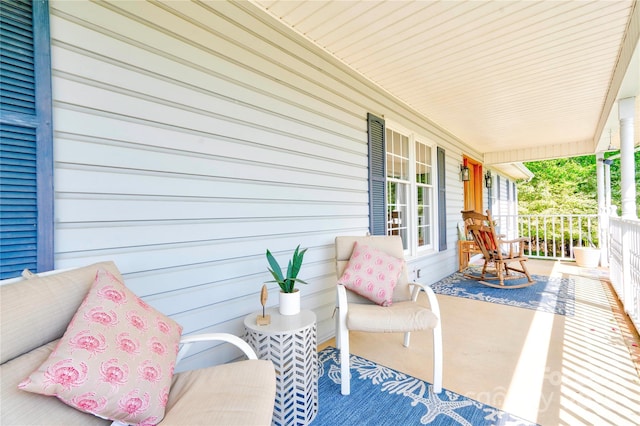 wooden terrace featuring covered porch