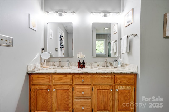 bathroom with double vanity and a sink