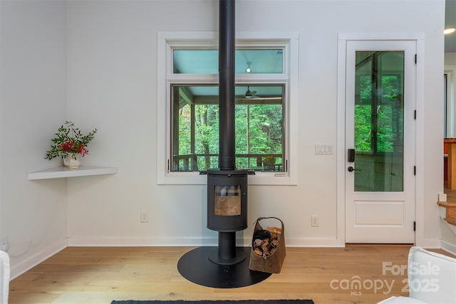 entryway featuring light wood finished floors and baseboards