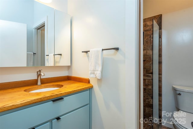 full bath with toilet and vanity