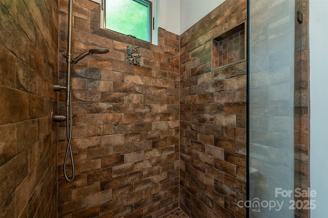 bathroom with tiled shower