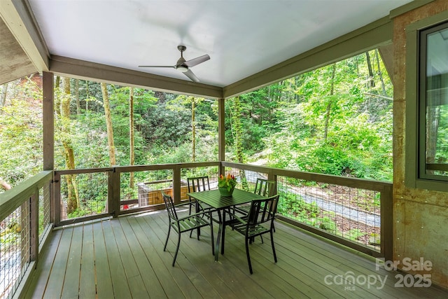 deck featuring ceiling fan and outdoor dining area
