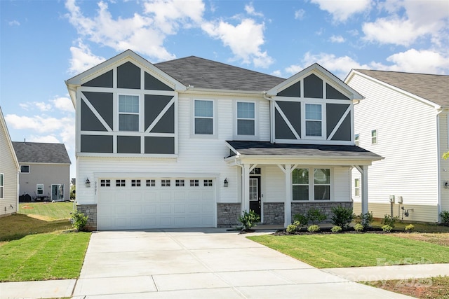 2021 Boynton St, Charlotte, NC 28269 - view of front of home with stone siding, a front lawn, a garage, and driveway