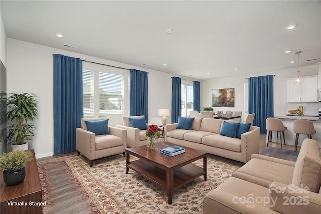 2021 Boynton St, Charlotte, NC 28269 - living room featuring light wood-type flooring, recessed lighting, and baseboards