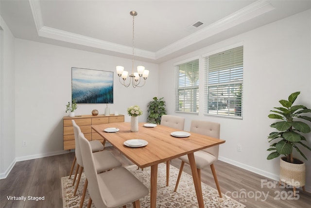 2021 Boynton St, Charlotte, NC 28269 - dining room with wood finished floors, a raised ceiling, ornamental molding, and baseboards