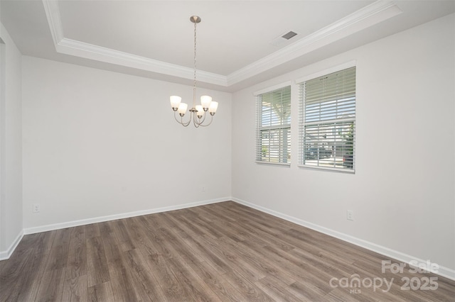 2021 Boynton St, Charlotte, NC 28269 - unfurnished room with a raised ceiling, crown molding, wood finished floors, baseboards, and a chandelier