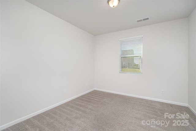 2021 Boynton St, Charlotte, NC 28269 - spare room with baseboards and carpet floors
