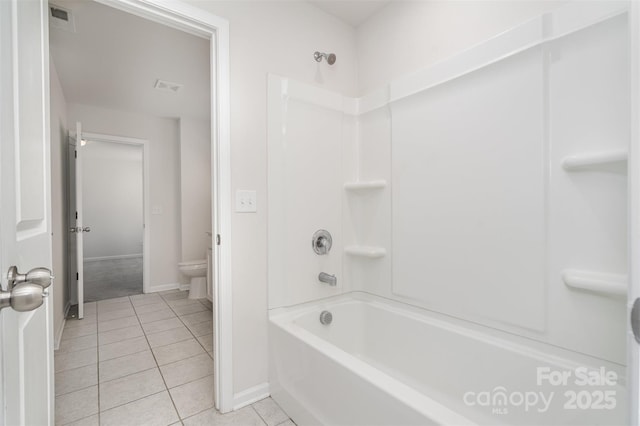 2021 Boynton St, Charlotte, NC 28269 - full bathroom with tile patterned flooring, toilet, baseboards, and shower / tub combination
