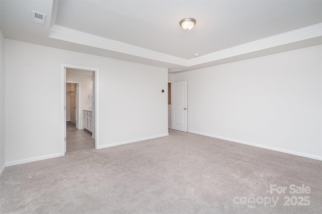 2021 Boynton St, Charlotte, NC 28269 - spare room with a raised ceiling, carpet floors, crown molding, and baseboards