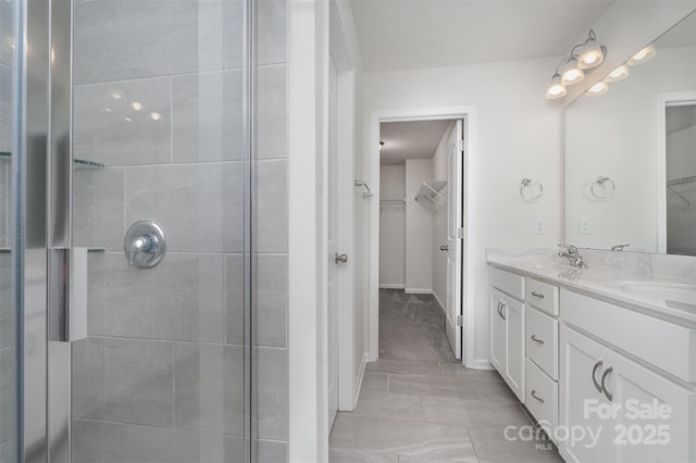 2021 Boynton St, Charlotte, NC 28269 - full bathroom featuring a shower stall, double vanity, and a walk in closet