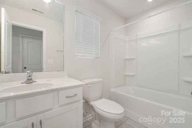 2021 Boynton St, Charlotte, NC 28269 - full bathroom featuring tile patterned flooring, toilet, vanity, tub / shower combination, and baseboards