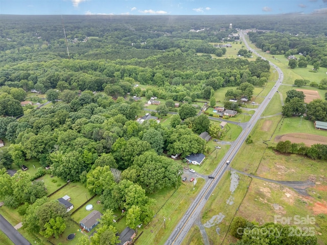 5240 Old Monroe Rd, Indian Trail, NC 28079 - aerial view of property and surrounding area with a heavily wooded area