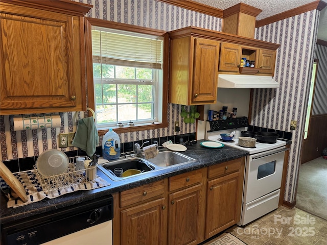 kitchen with under cabinet range hood, white appliances, and wallpapered walls