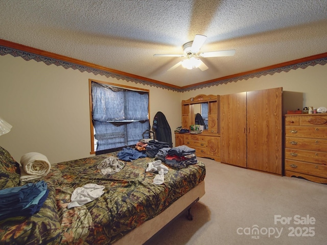 bedroom with light colored carpet, a textured ceiling, a ceiling fan, and ornamental molding