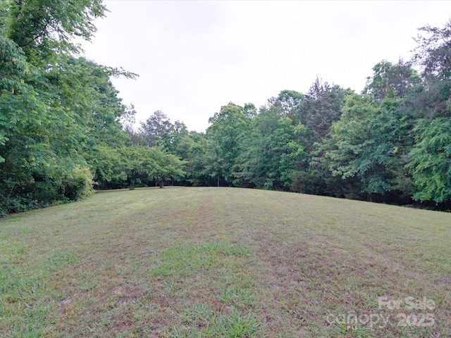 view of yard with a forest view