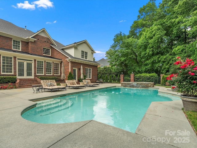 13029 Whisper Creek Dr, Charlotte, NC 28277 - view of swimming pool featuring french doors, a patio, outdoor lounge area, and a pool with connected hot tub