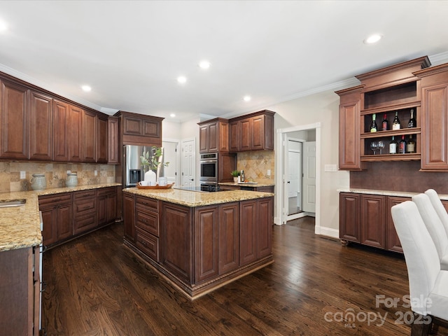 13029 Whisper Creek Dr, Charlotte, NC 28277 - kitchen with appliances with stainless steel finishes, decorative backsplash, recessed lighting, dark wood-style floors, and a kitchen island