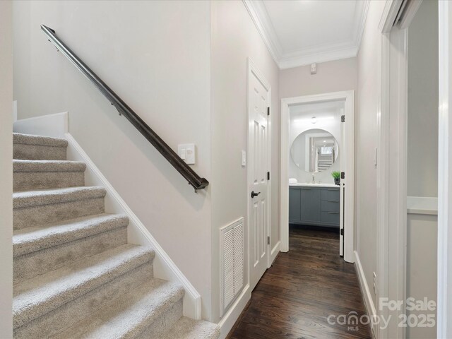 13029 Whisper Creek Dr, Charlotte, NC 28277 - hall with crown molding, stairs, and dark wood-type flooring