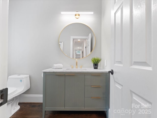 13029 Whisper Creek Dr, Charlotte, NC 28277 - half bathroom with vanity, toilet, wood finished floors, and baseboards