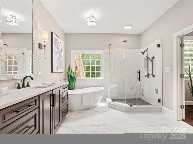 13029 Whisper Creek Dr, Charlotte, NC 28277 - bathroom featuring vanity, a freestanding bath, a marble finish shower, and marble finish flooring