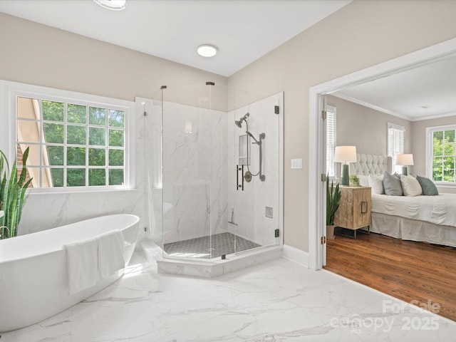 13029 Whisper Creek Dr, Charlotte, NC 28277 - ensuite bathroom featuring a soaking tub, a marble finish shower, ornamental molding, marble finish floors, and baseboards