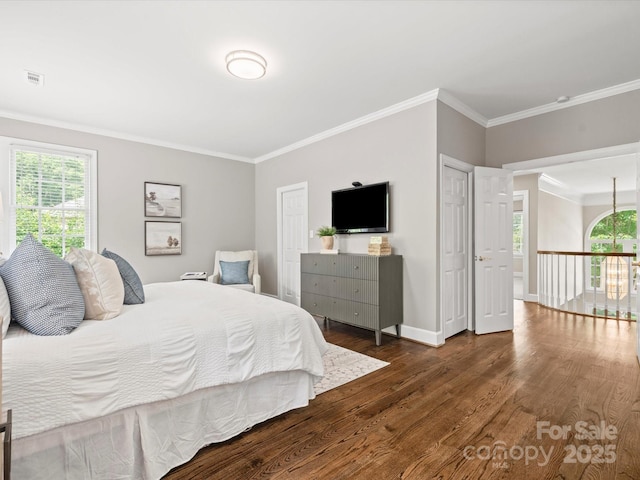 13029 Whisper Creek Dr, Charlotte, NC 28277 - bedroom with dark wood-type flooring, ornamental molding, multiple windows, and baseboards