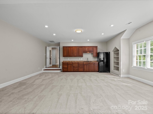 13029 Whisper Creek Dr, Charlotte, NC 28277 - kitchen featuring black refrigerator with ice dispenser, light carpet, baseboards, a sink, and recessed lighting