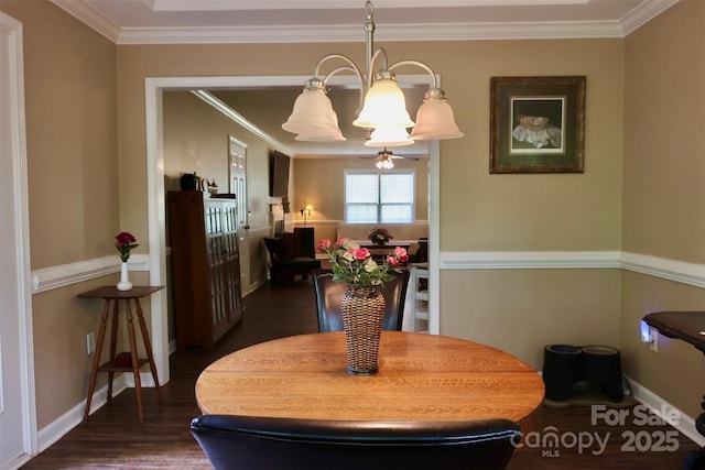 dining area with crown molding, a chandelier, baseboards, and dark wood-style floors