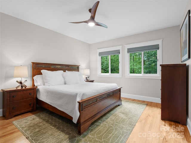 33 Village Pointe Ln, Asheville, NC 28803 - bedroom with baseboards, light wood-style floors, and ceiling fan