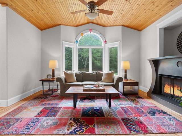 33 Village Pointe Ln, Asheville, NC 28803 - living area featuring ornamental molding, a ceiling fan, a lit fireplace, wood finished floors, and baseboards