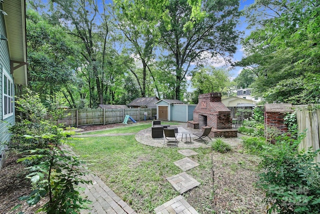 view of yard with a patio, a storage unit, and an outdoor structure