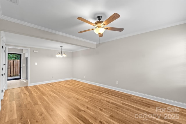 empty room featuring baseboards, crown molding, light wood-type flooring, and ceiling fan with notable chandelier