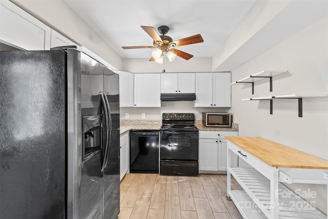 kitchen with a ceiling fan, under cabinet range hood, open shelves, black appliances, and white cabinets