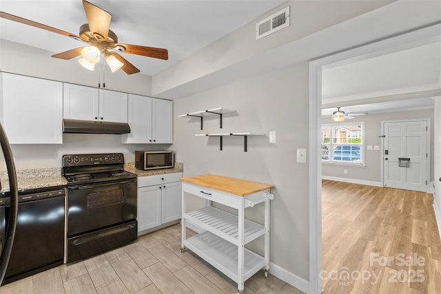 kitchen featuring a ceiling fan, black range with electric cooktop, visible vents, stainless steel microwave, and under cabinet range hood