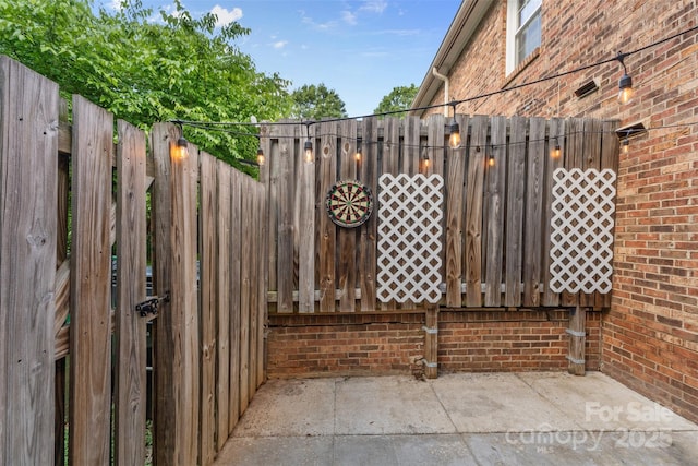 view of gate with fence