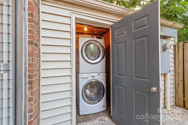laundry area with laundry area and stacked washer and dryer