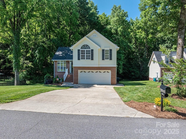 319 Beacon Hills Dr, Gastonia, NC 28056 - view of front of home with an attached garage, driveway, brick siding, and a front lawn