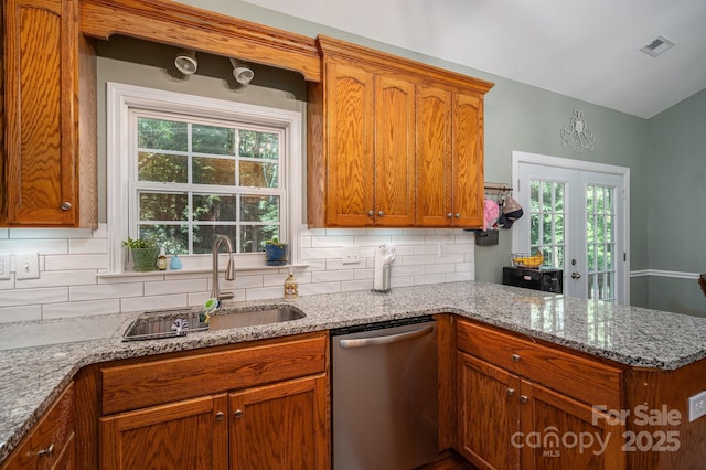 319 Beacon Hills Dr, Gastonia, NC 28056 - kitchen with dishwasher, a sink, decorative backsplash, a peninsula, and light stone counters
