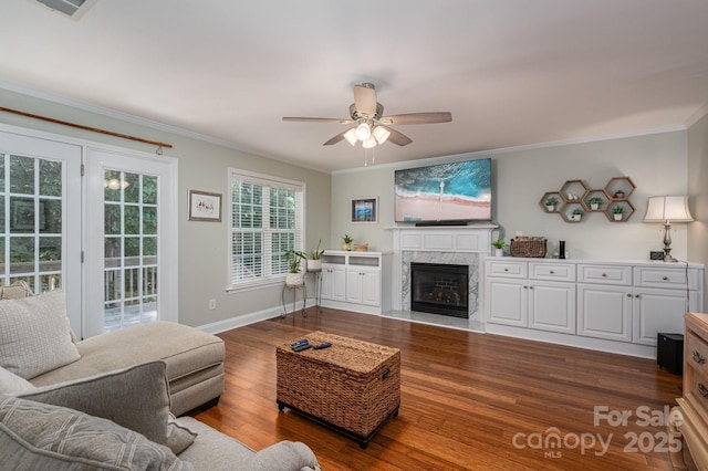 319 Beacon Hills Dr, Gastonia, NC 28056 - living room with crown molding, wood finished floors, ceiling fan, a high end fireplace, and baseboards