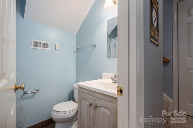 319 Beacon Hills Dr, Gastonia, NC 28056 - full bath with vaulted ceiling, vanity, toilet, and baseboards