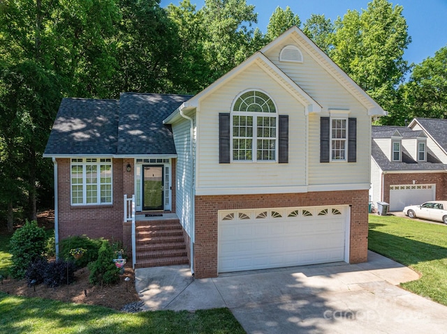 319 Beacon Hills Dr, Gastonia, NC 28056 - split level home with brick siding, driveway, and a garage