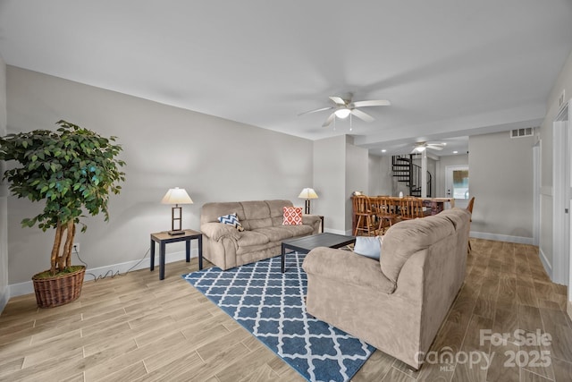 1077 Jackson Rd, Fort Lawn, SC 29714 - living room with ceiling fan, wood finished floors, baseboards, and stairs