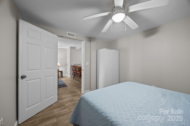 1077 Jackson Rd, Fort Lawn, SC 29714 - bedroom with wood finished floors, a ceiling fan, and baseboards