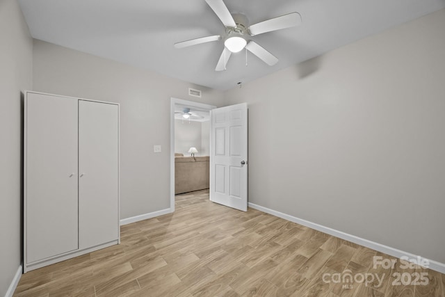 1077 Jackson Rd, Fort Lawn, SC 29714 - unfurnished bedroom featuring light wood finished floors, baseboards, a closet, and ceiling fan