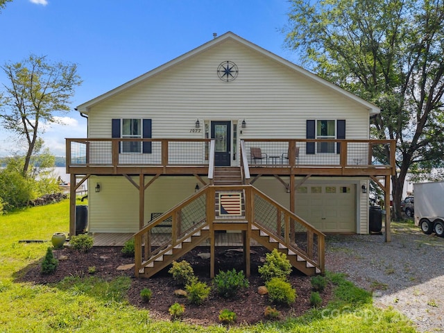 1077 Jackson Rd, Fort Lawn, SC 29714 - rear view of property with stairs, a garage, gravel driveway, and a deck