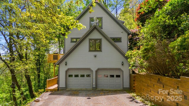 view of home's exterior featuring driveway and an attached garage