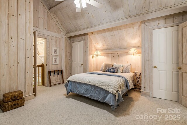 carpeted bedroom featuring wood walls, wood ceiling, and a ceiling fan